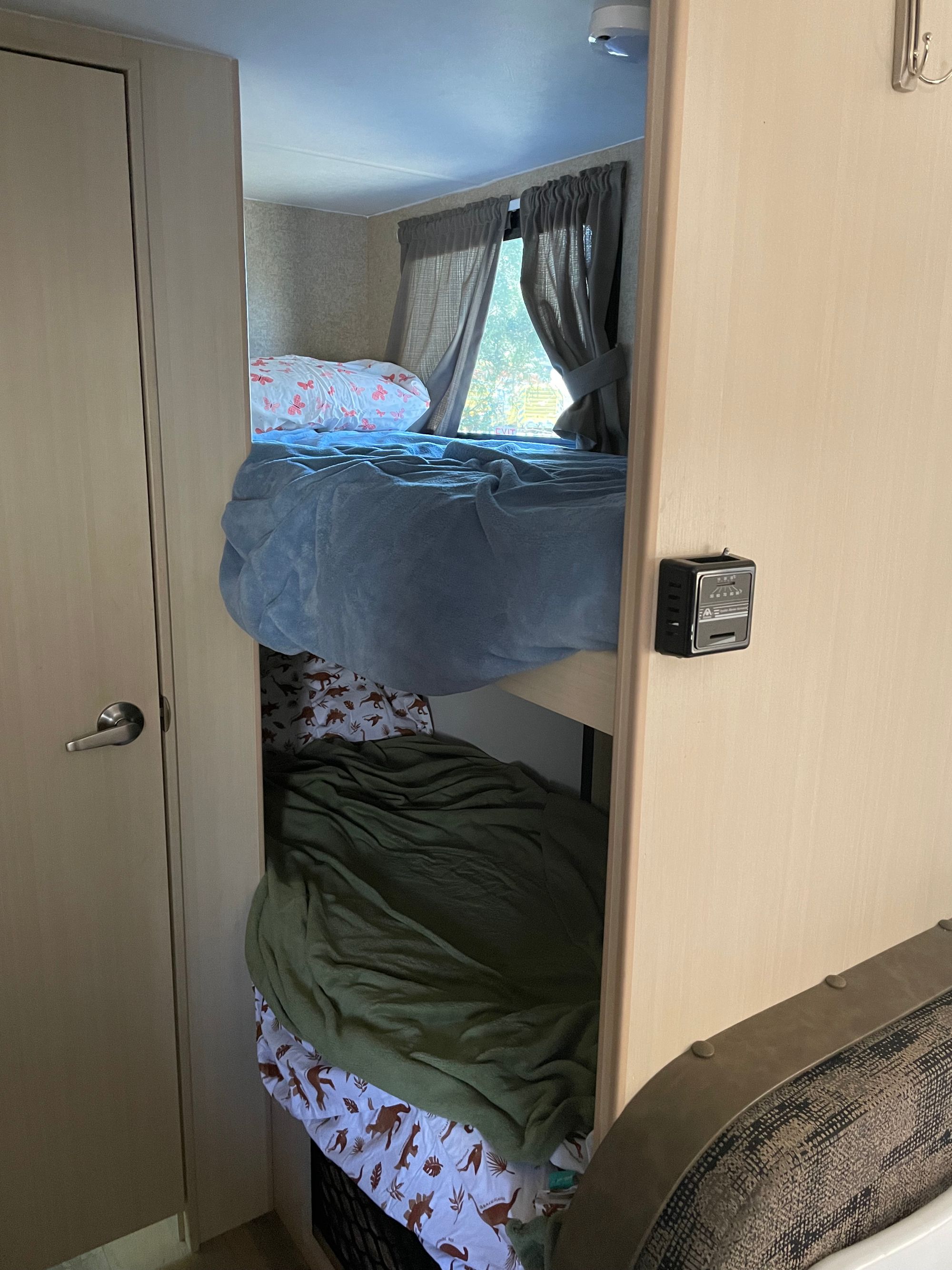 Top and bottom bunk beds with bedding.