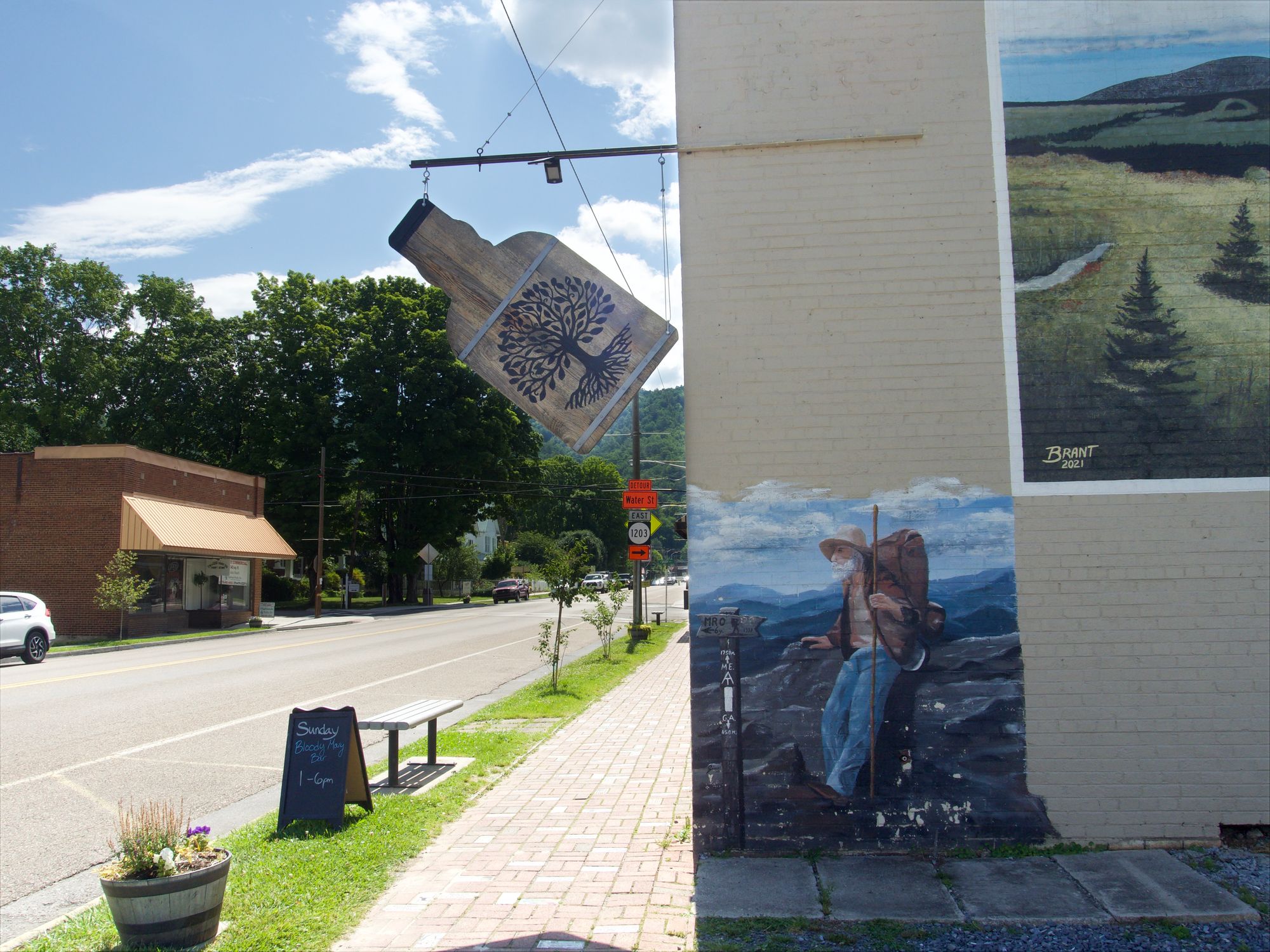 A smaller mural of a hiker.